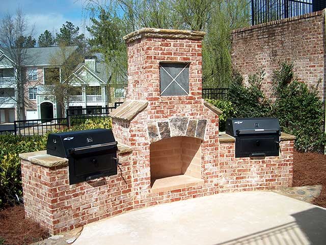 outdoor brick fireplace with grill