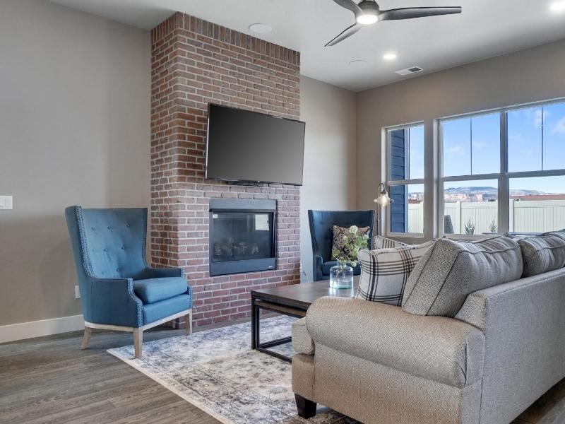 Brick fireplace with a wall mounted TV in a residential living room in Madison AL